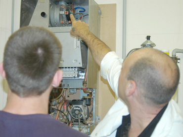 Tutor explaining flue fault on a gas boiler